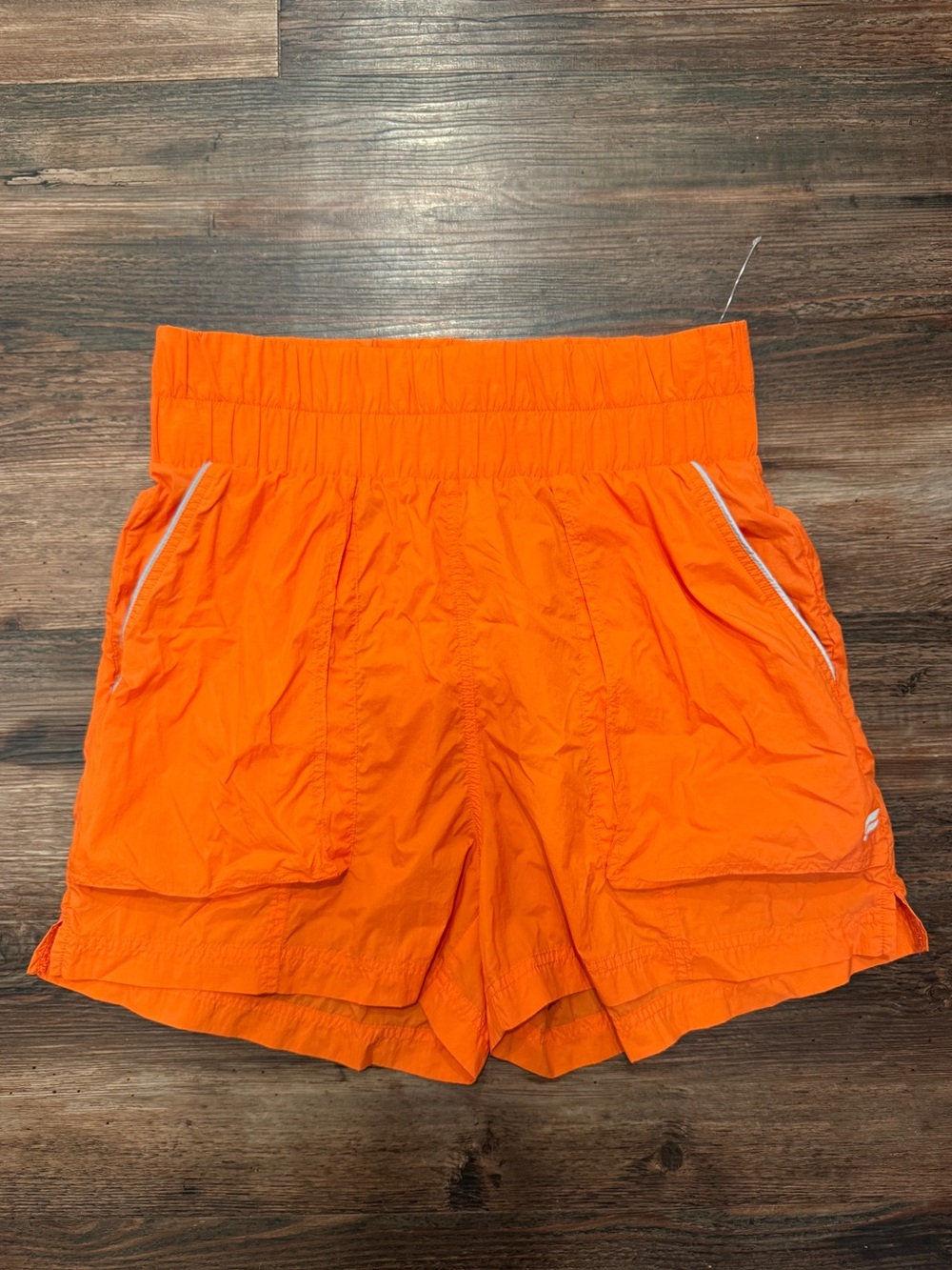 Fabletics Ultra High-Waisted Piped Nylon Shorts in Orange